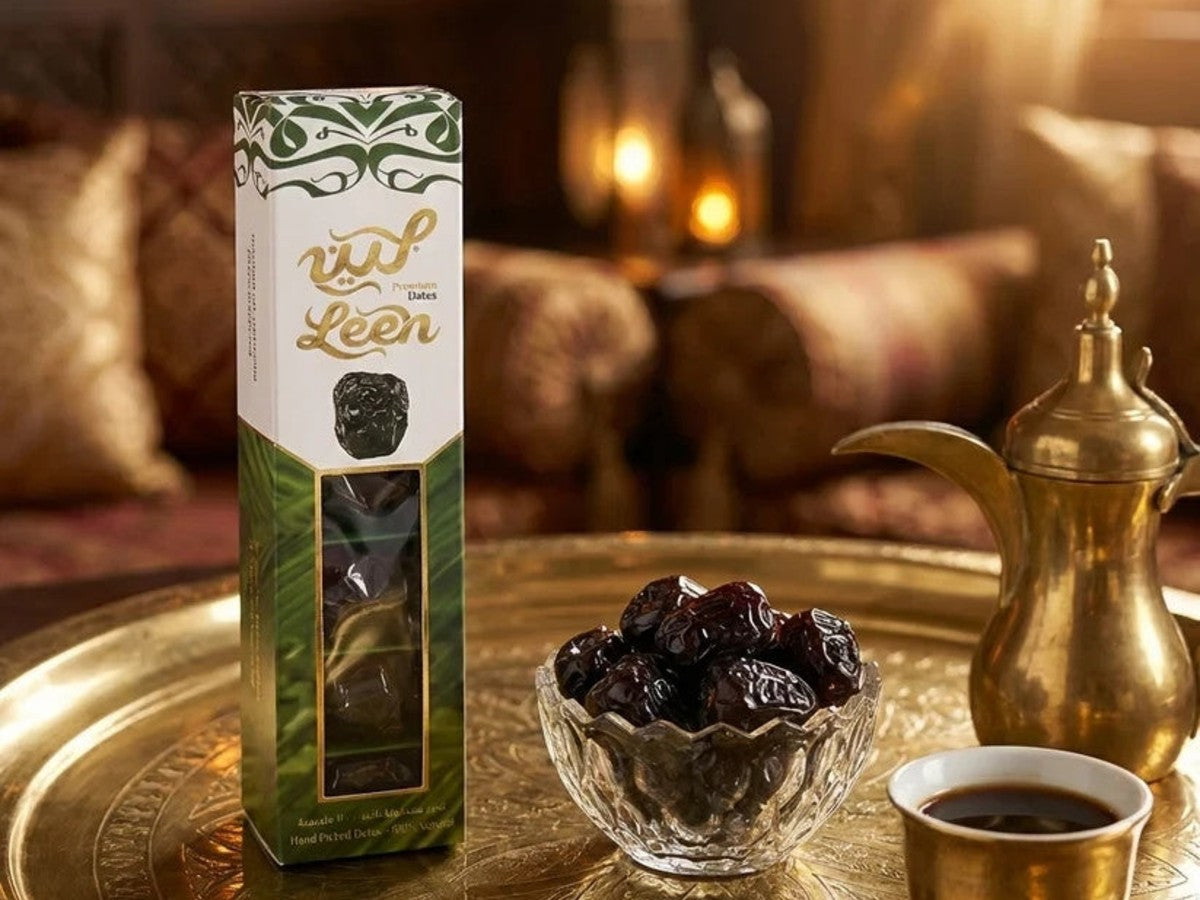 Leen Ajwa dates box with a bowl of Ajwa dates and Arabic coffee