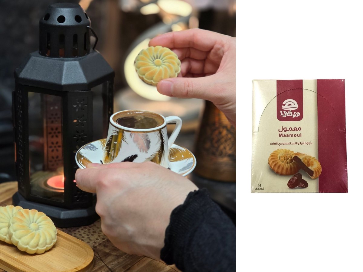 Maamoul cookies with a cup of coffee and a lantern, beside a box of Herfy maamoul with dates