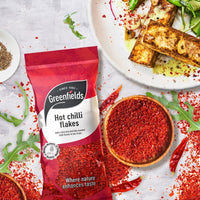 Greenfields hot chilli flakes pack with a bowl of flakes and grilled chicken