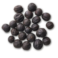 Pile of whole dried black limes (loomi)