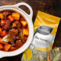 Greenfields bay leaves pack beside a beef and vegetable stew