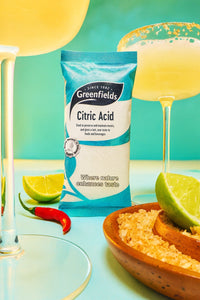 Greenfields citric acid pack with lemonade glasses and a lime