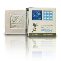 Al'Ard Nabulsi olive oil soap bar beside its box