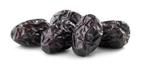Close-up of dark, wrinkled Ajwa dates