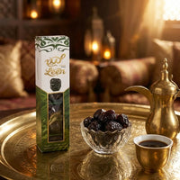 Leen Ajwa dates box on a brass tray with Arabic coffee and a bowl of dates