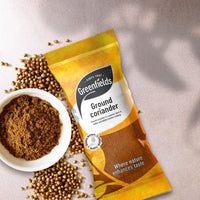 Greenfields ground coriander pack with coriander seeds and a bowl of the powder