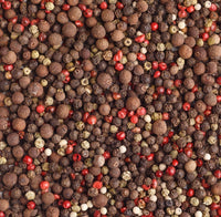 Close-up of mixed black, white, pink and green peppercorns