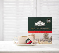 Ahmad Tea English Breakfast box beside a cup of tea