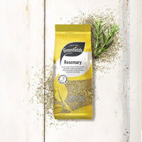 Greenfields dried rosemary pack on a white wooden table with rosemary