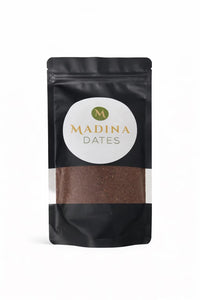 Madina date seed powder in a black stand-up pouch